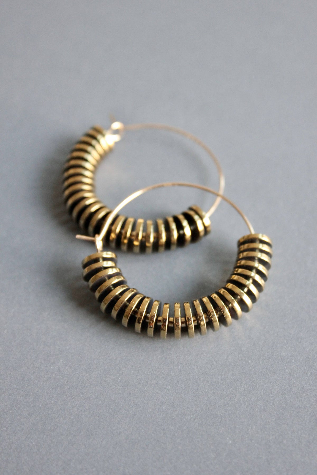 David Aubrey |  Gold hematite hoop earrings